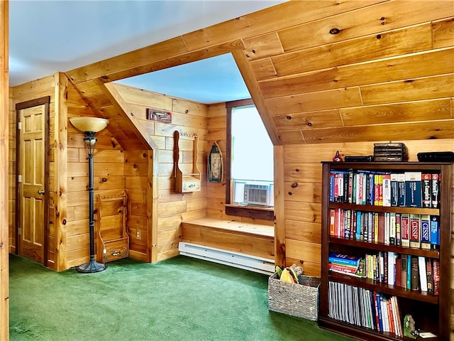 living area featuring wood walls, vaulted ceiling, a baseboard heating unit, and dark carpet