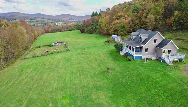 birds eye view of property with a mountain view