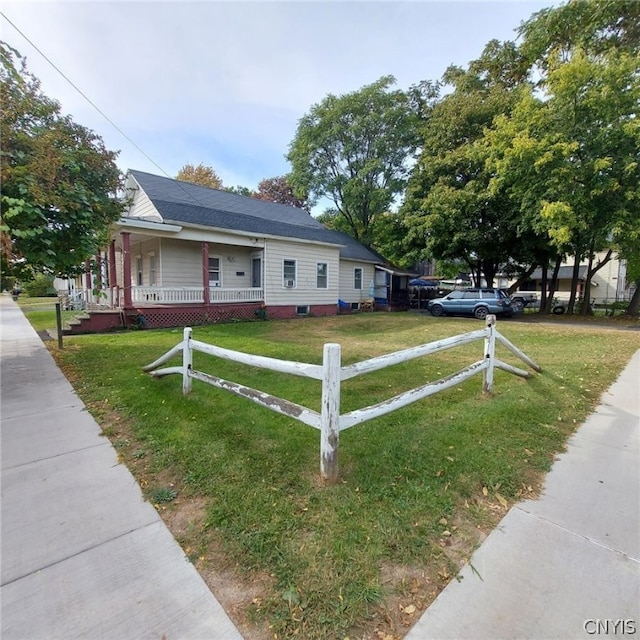 view of front of home featuring covered porch and a front yard