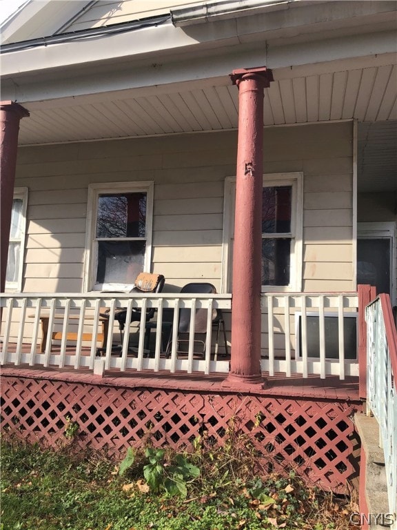 rear view of house with covered porch