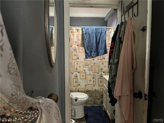 bathroom featuring vanity and toilet