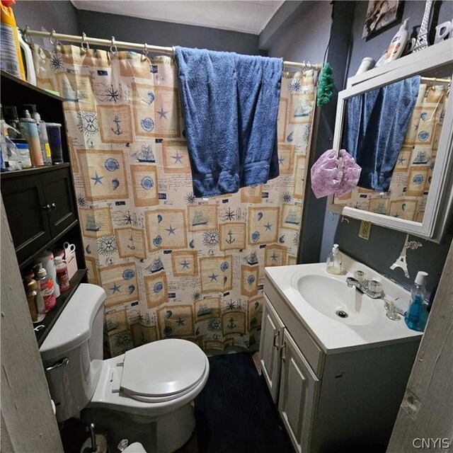 bathroom with vanity and toilet