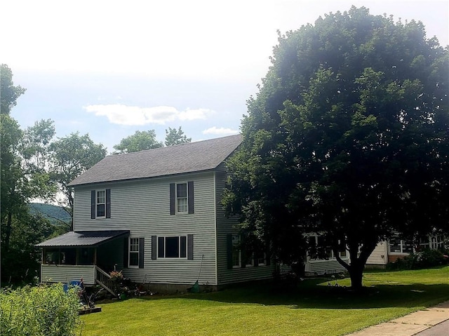 view of property exterior featuring a lawn