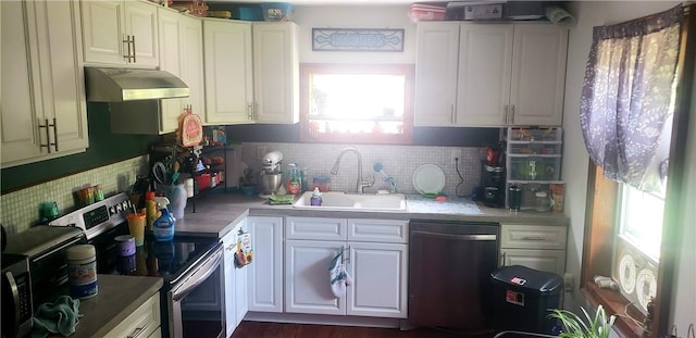 kitchen with white cabinetry, sink, decorative backsplash, and appliances with stainless steel finishes