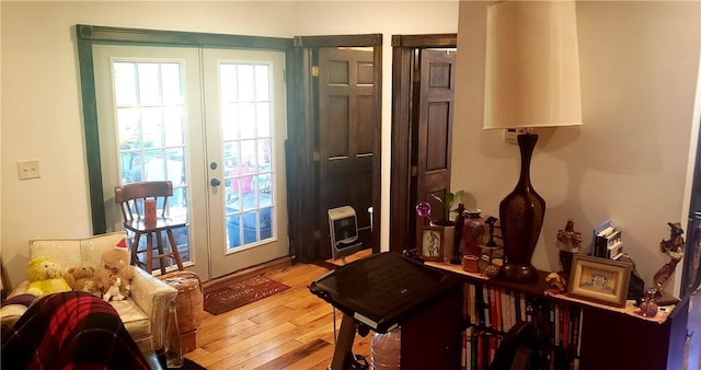 doorway to outside with french doors and light wood-type flooring