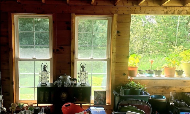 doorway to outside featuring wooden walls