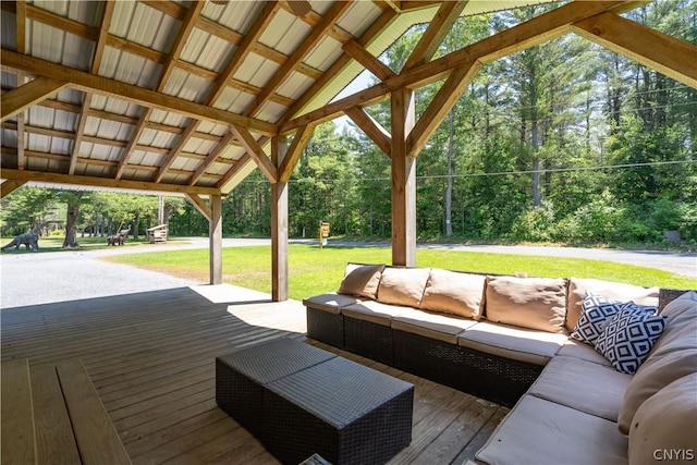 deck with a yard and outdoor lounge area