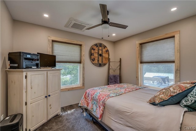 bedroom with dark wood-type flooring and ceiling fan