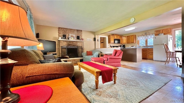 living room with sink and a fireplace