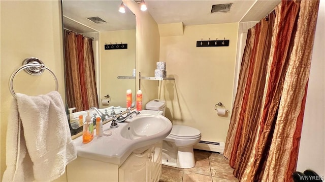 bathroom with tile patterned flooring, vanity, toilet, and a baseboard radiator