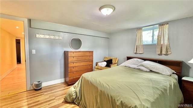 bedroom with hardwood / wood-style flooring