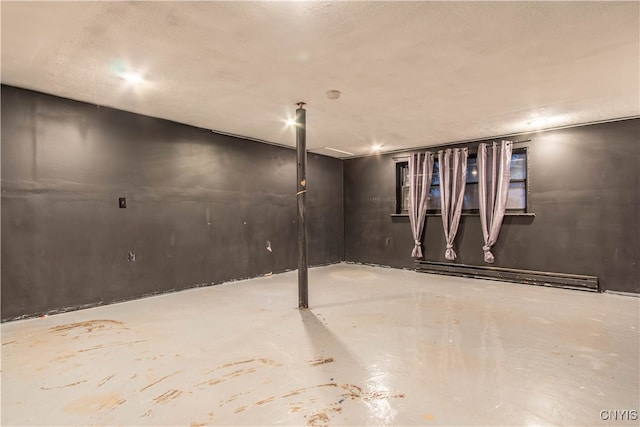 basement featuring a baseboard radiator