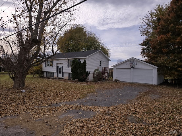 view of front facade with an outbuilding and a garage