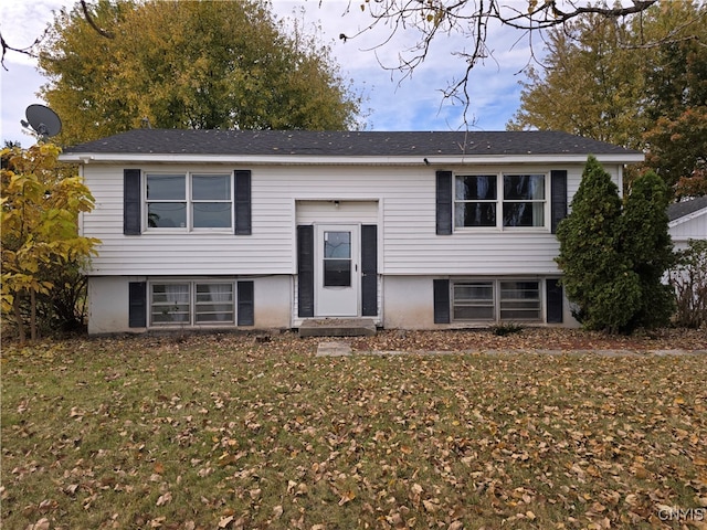 split foyer home with a front lawn