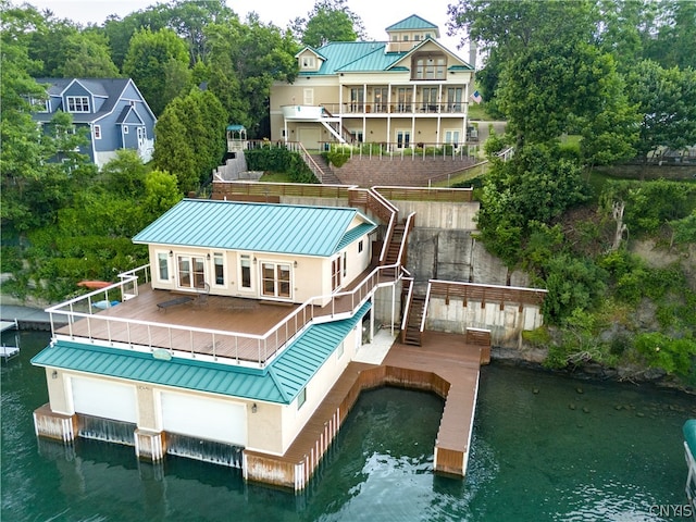 rear view of property with a water view