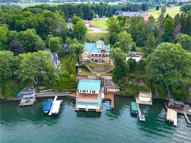 birds eye view of property with a water view