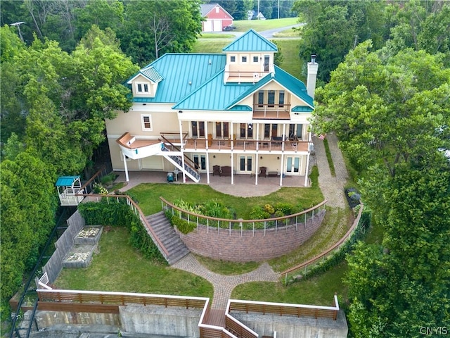 back of house with a patio and a wooden deck