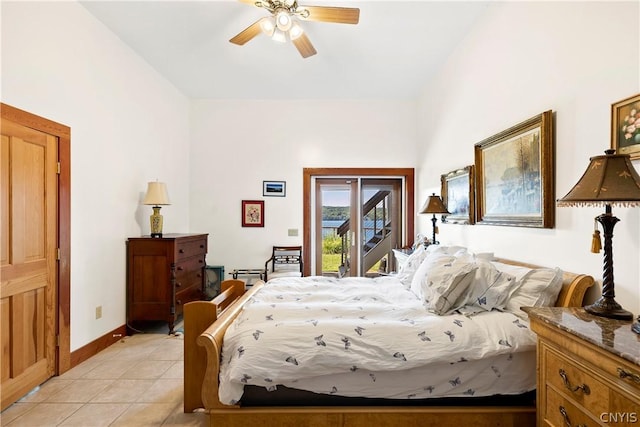 tiled bedroom featuring access to outside and ceiling fan