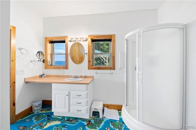 bathroom featuring vanity and walk in shower