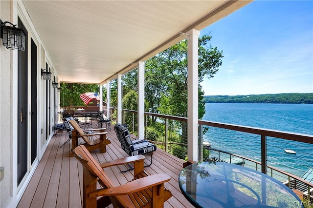 wooden deck featuring a water view