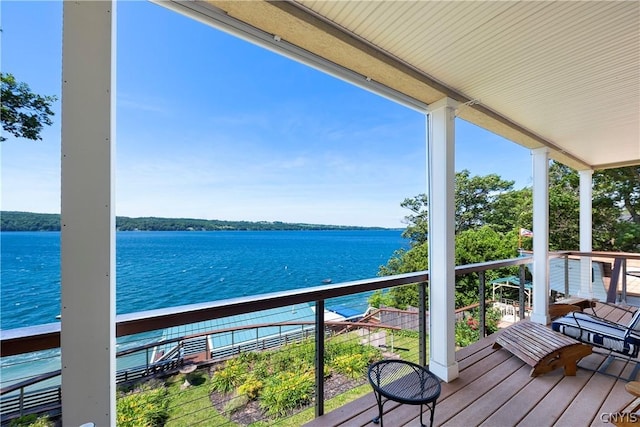 balcony featuring a water view