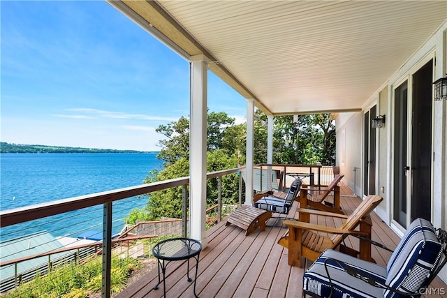 deck featuring a water view