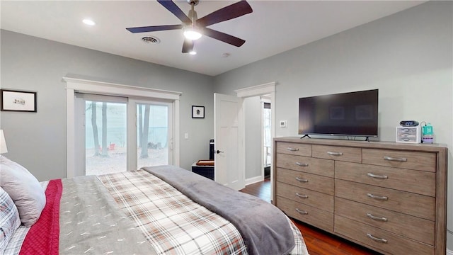 bedroom with access to outside, ceiling fan, and dark hardwood / wood-style floors