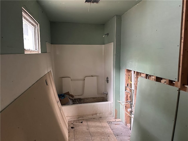 bathroom with tile patterned floors