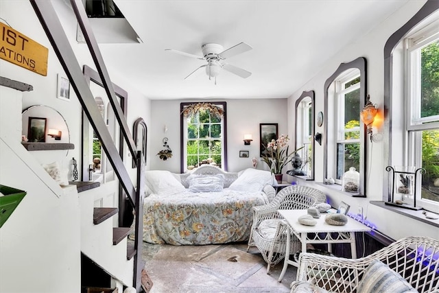 bedroom with multiple windows and ceiling fan