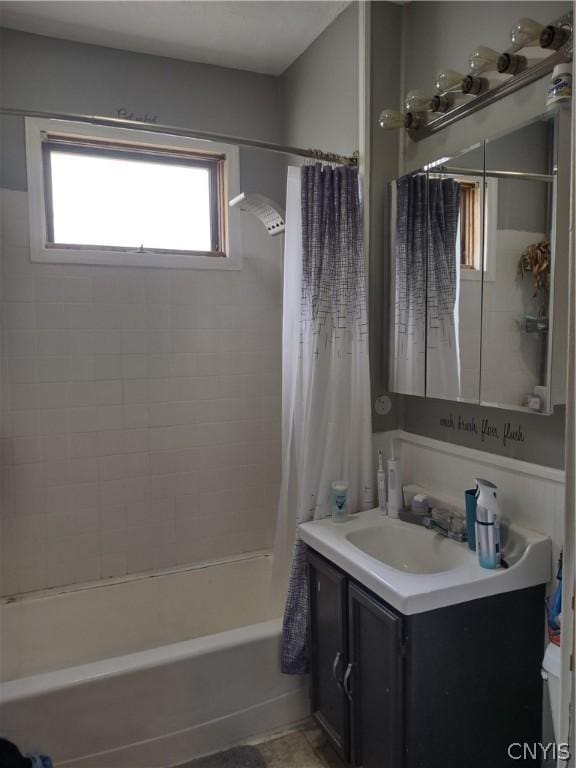 bathroom with vanity and shower / tub combo with curtain