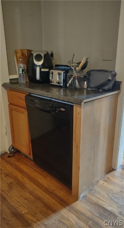 interior space with light hardwood / wood-style floors and dishwasher