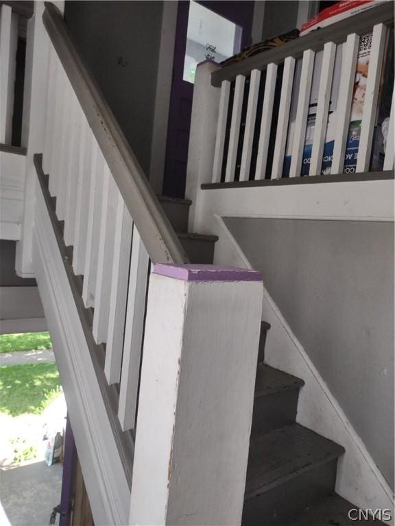 stairs with concrete floors