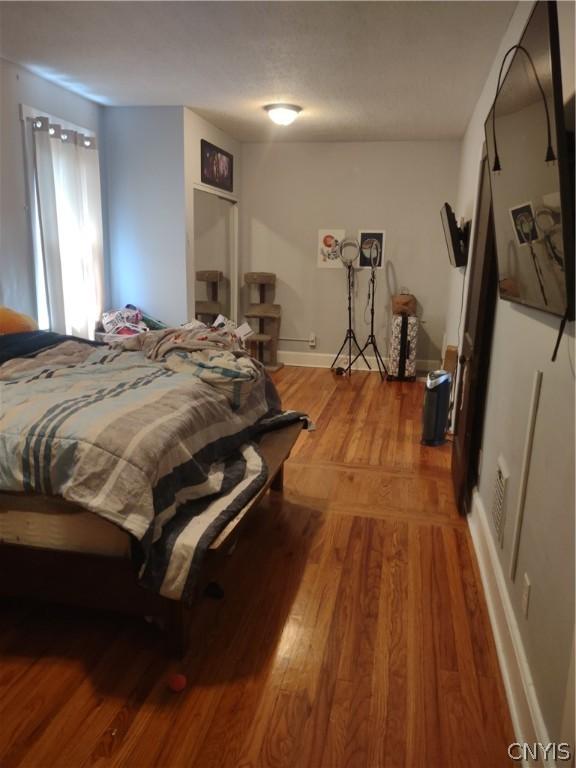 bedroom featuring hardwood / wood-style flooring