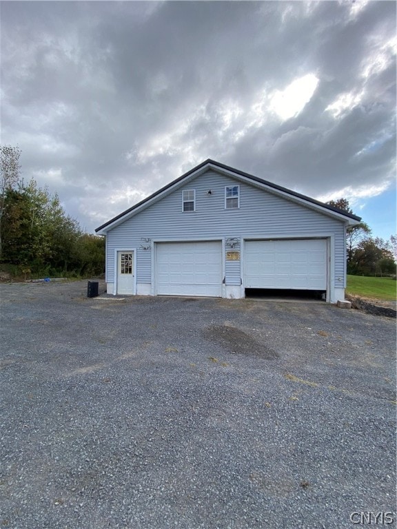 view of side of property with a garage