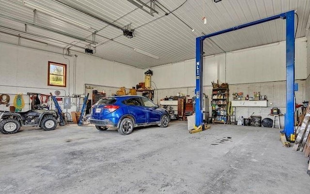 garage with a garage door opener and a carport