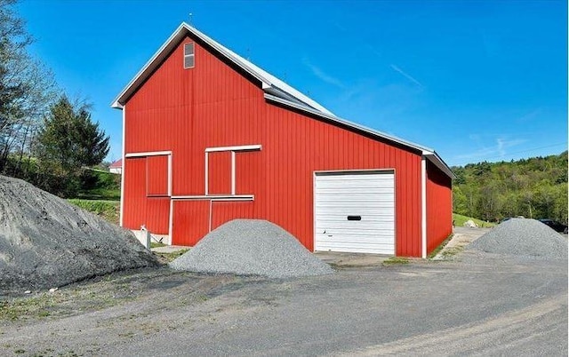 view of outbuilding featuring a garage