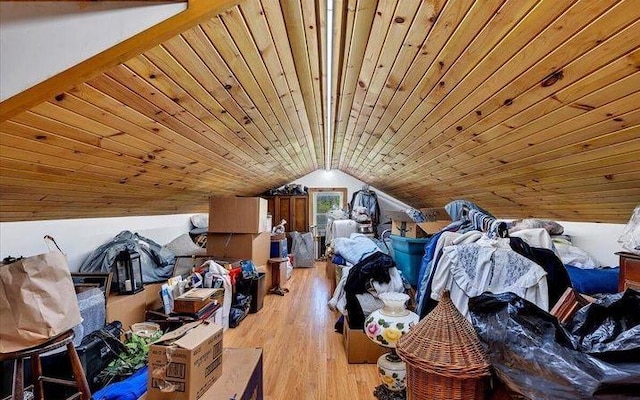 additional living space featuring wood ceiling, lofted ceiling, and light hardwood / wood-style flooring