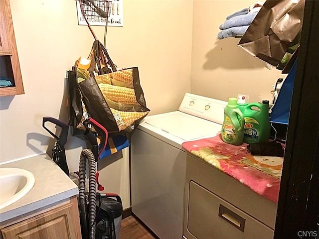 laundry room featuring cabinet space and separate washer and dryer