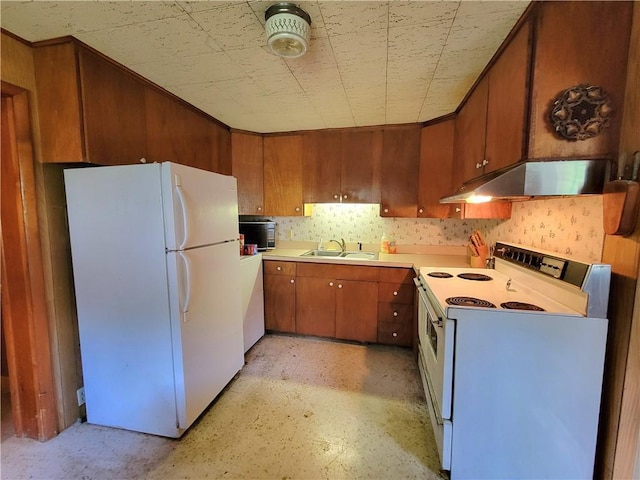 kitchen featuring sink and white appliances