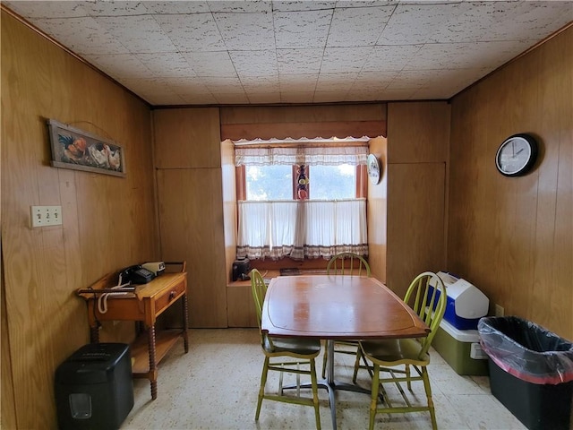 dining area with wood walls