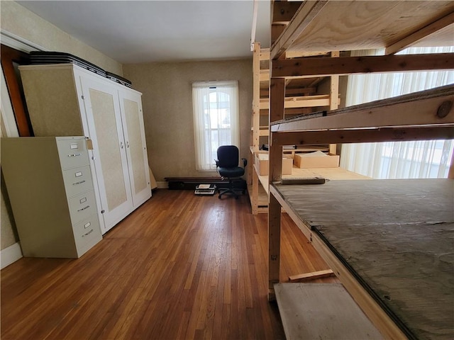 unfurnished bedroom with wood-type flooring