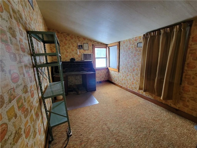 miscellaneous room featuring carpet and vaulted ceiling