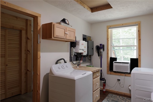 clothes washing area featuring cabinets, a textured ceiling, electric panel, and independent washer and dryer