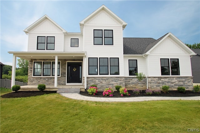 view of front of home featuring a porch and a front lawn