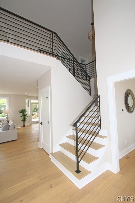 stairs featuring wood-type flooring