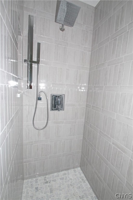 bathroom with tiled shower