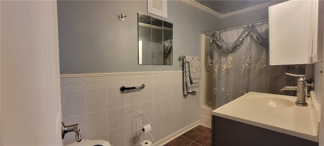 bathroom with vanity, shower / tub combo with curtain, tile walls, tile patterned floors, and ornamental molding