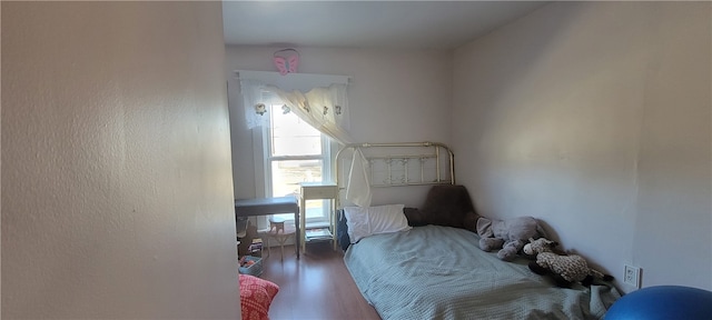 bedroom featuring hardwood / wood-style flooring