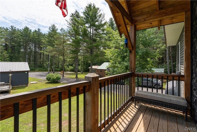 wooden terrace with a yard