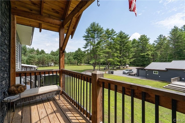 wooden terrace with a yard